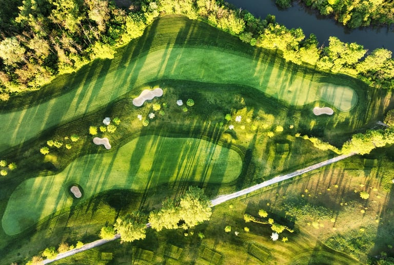 Aerial view of a green golf field