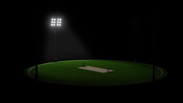 Cricket field under stadium floodlights at night