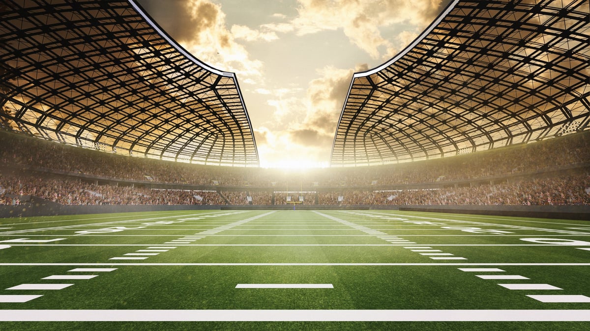 3D American football stadium view with dramatic sunset sky