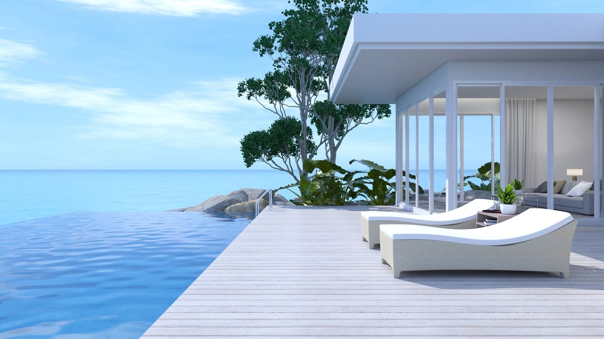 Sunbathing on the seaside terrace with swimming pool