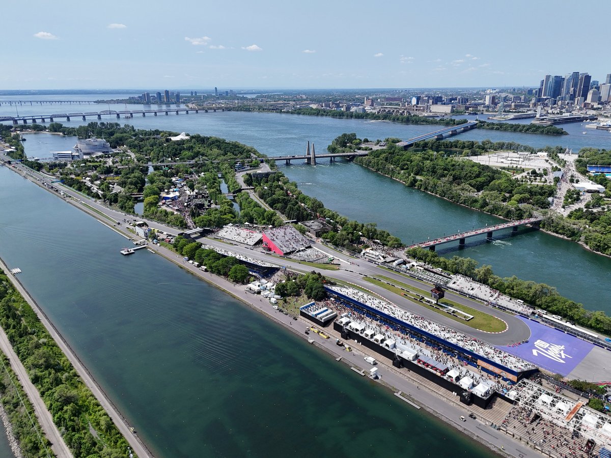 Helicopter view of Formula 1 circuit grandstands and city skyline