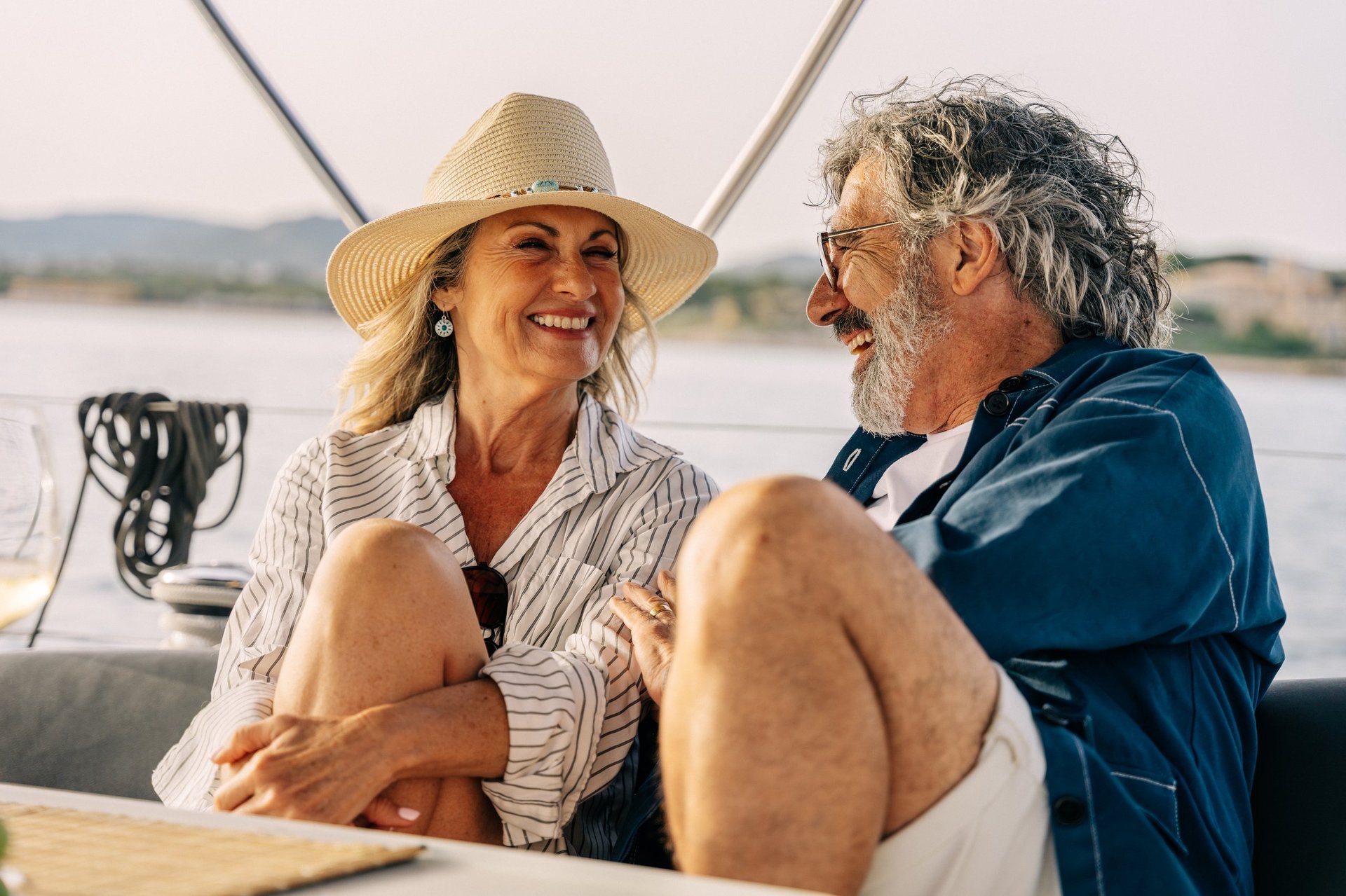 Couple enjoying a luxury trip at sea, evoking premium mobility and travel